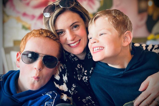 <p>Alex McQuade with sons Evan (left) and Xander (right), who have Fragile X syndrome</p>