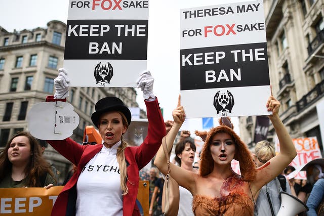 <p>Anti fox hunting protesters march through the streets of London on 29 May 2017</p>