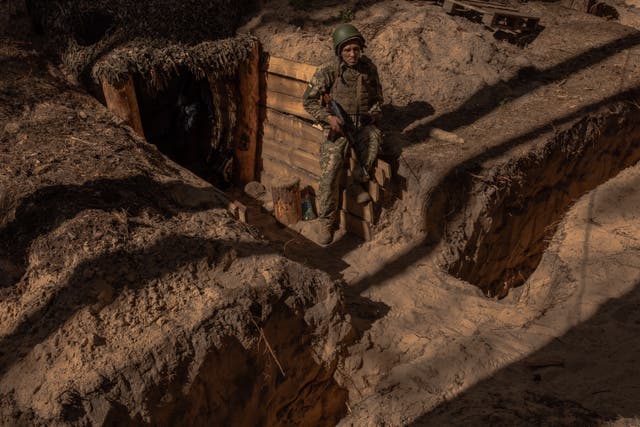 <p>A Ukrainian convict who joined the 92nd Assault Brigade of Ukraine’s army stands guard in an undisclosed area in the Kharkiv region</p>