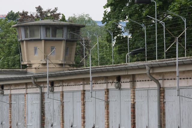 <p>A guard tower stands at the former prison of the East German, communist-era secret police, known as the Stasi</p>