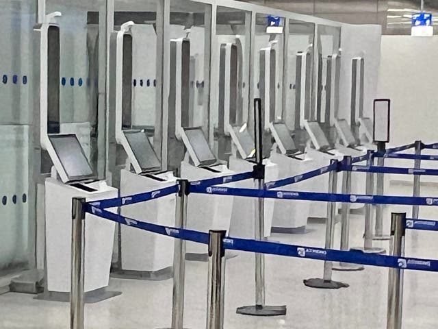 <p>Ready for action: Booths at Athens airport for taking fingerprints and photographs of ‘third-country nationals’ such as British travellers</p>