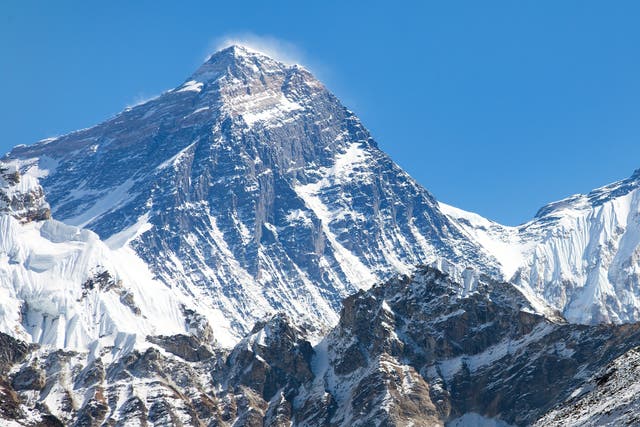 <p>Mount Everest’s summit, the wind-scoured southwest face and snowy pass of the South Col under deep blue high-altitude skies in the Himalayas</p>