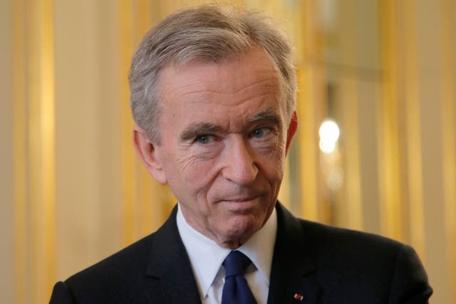 <p>Mr Arnault, who founded the luxury firm LVMH, has an estimated net worth of £135bn </p>