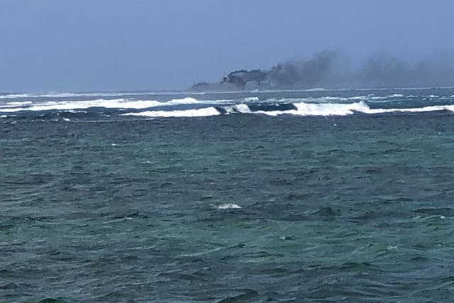 <p>A New Zealand Navy vessel on fire, as seen from Tafitoala, Samoa, 6 October 2024</p>