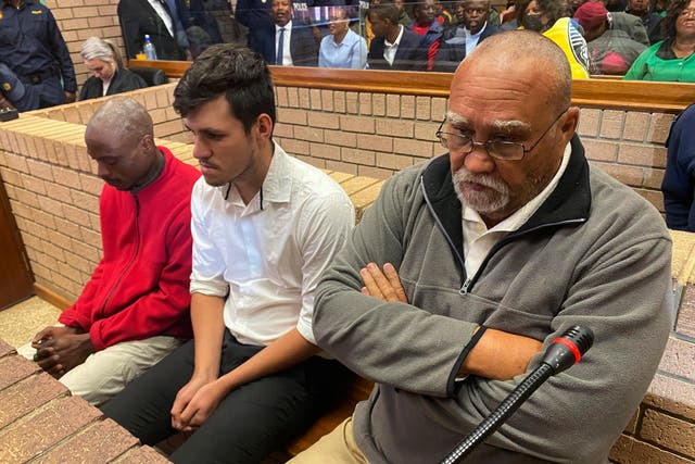 <p>Three men accused of killing two women and feeding their bodies to pigs, from right to left, farm-owner, Zachariah Olivier, supervisor, Adrian Rudolph de Wet and employee, William Musora appear in court Polokwane, South Africa, Tuesday, Sept. 10, 2024</p>