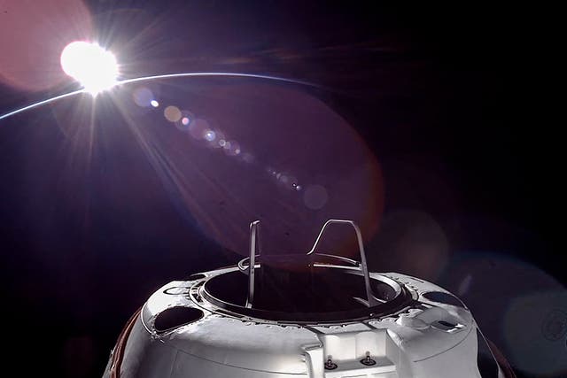 <p>This handout picture courtesy of SpaceX and Polaris taken on September 12, 2024, shows an orbital sunset from the SpaceX Dragon capsule with a hatch structure called "Skywalker", ahead of the first private spacewalk performed by the crew of the SpaceX Polaris Dawn mission</p>