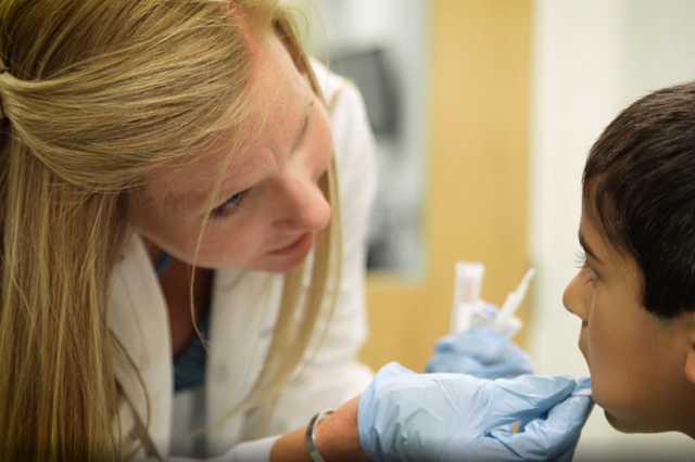 <p>Representational. Cheek swab taken from a child</p>