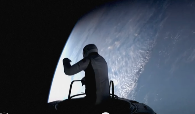 <p>Jared Isaacman, the billionaire funder of the mission, steps out of the spacecraft on the first ever private spacewalk</p>