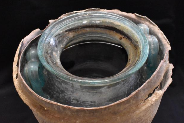 <p>The wine in the glass urn</p>
